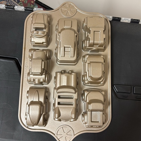 Practically new  Nordic Ware baking mold of eight mini car shapes. - Picture 6 of 7